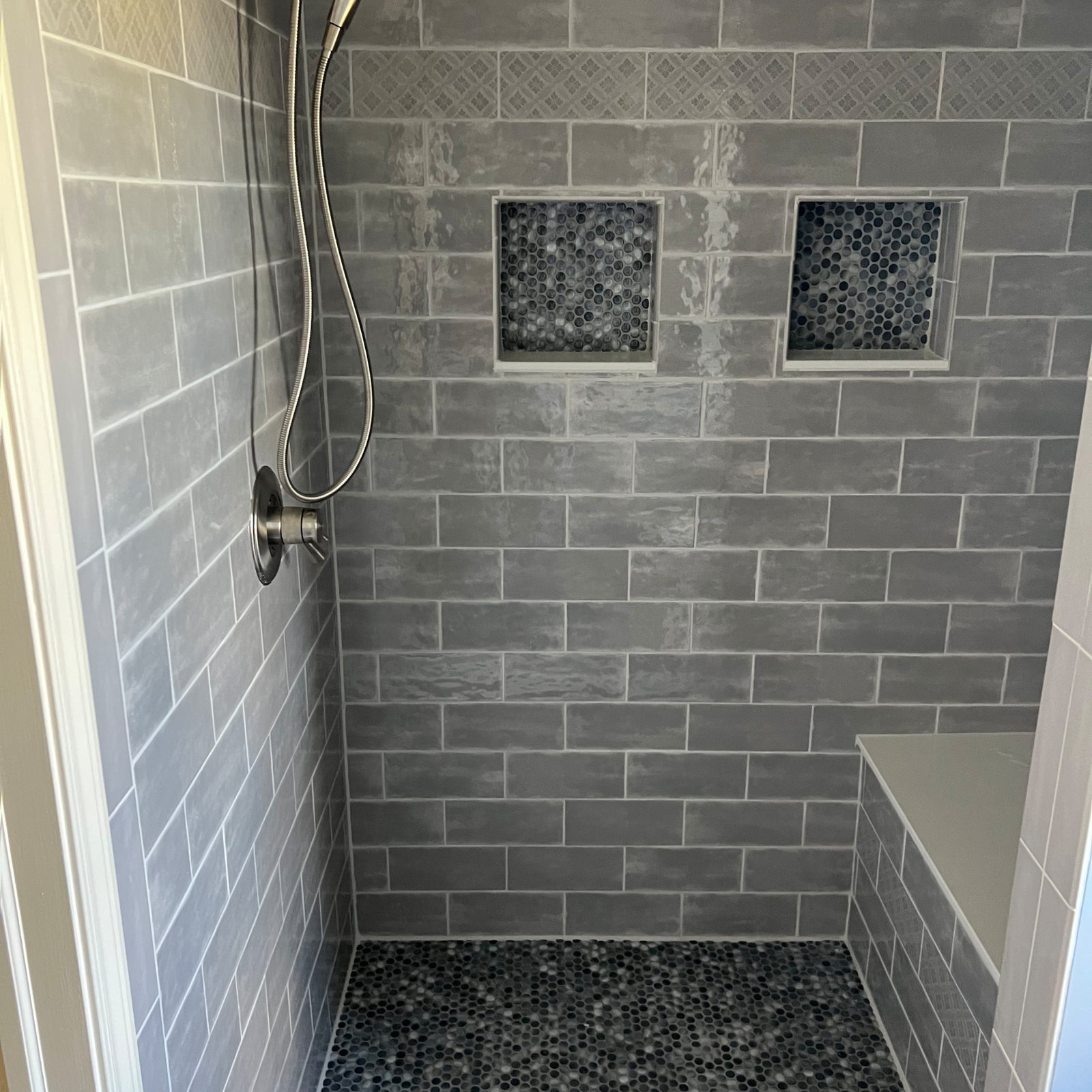 Tiled walk-in shower in a bathroom remodel by Sparrow Contracting in Ann Arbor, Michigan